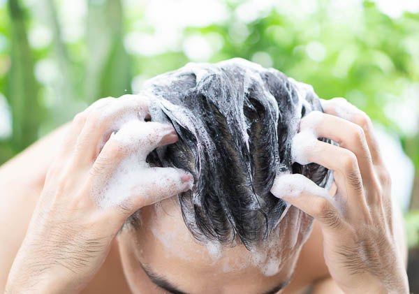 man washing his hair 
