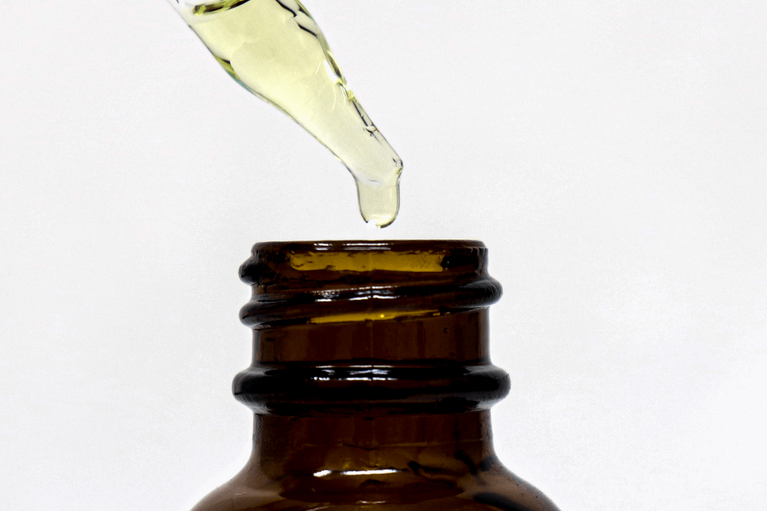 Bay Rum Beard Oil dropper with a drop of beard oil