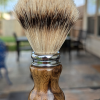 Silvertip badger shave brush with black limba handle outside on the patio