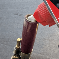 filling a lighter with lighter fluid