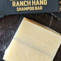 Ranch Hand All-In-One Hair, Face & Body Shampoo Bar for Men top view with the box and logo