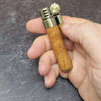 video of a steampunk style slim lighter with a handcrafted wood barrel made from texas mesquite