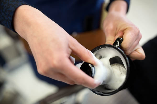 whipping up shave soap in a shave mug