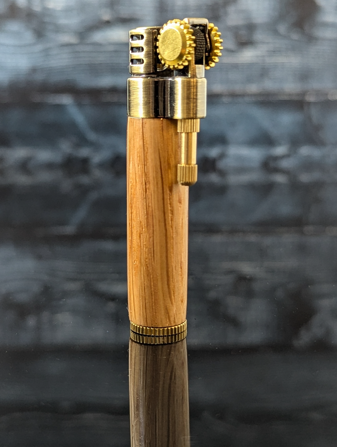 side view of a steampunk style slim lighter with a handcrafted wood barrel made from bourbon barrel oak 