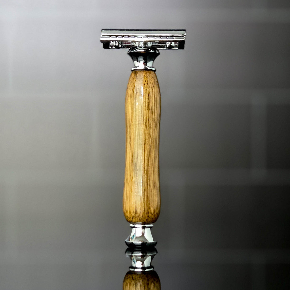 premium grooming razor mango hardwood handle standing upright