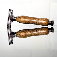 luxury wooden razor handle close up texture on a white background