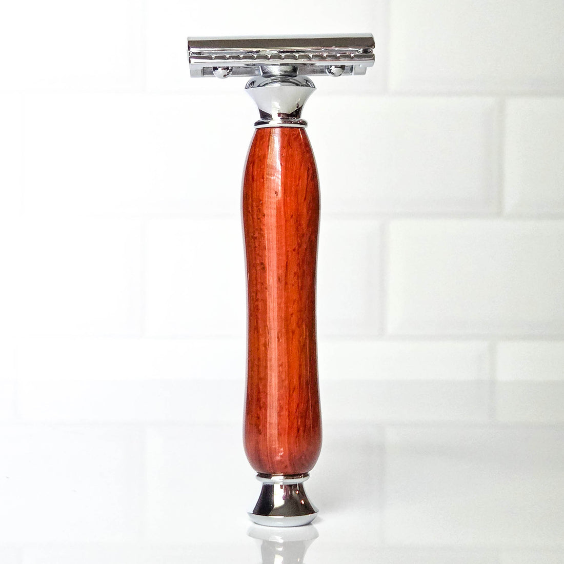 Shaving razor with a wooden handle on a white background