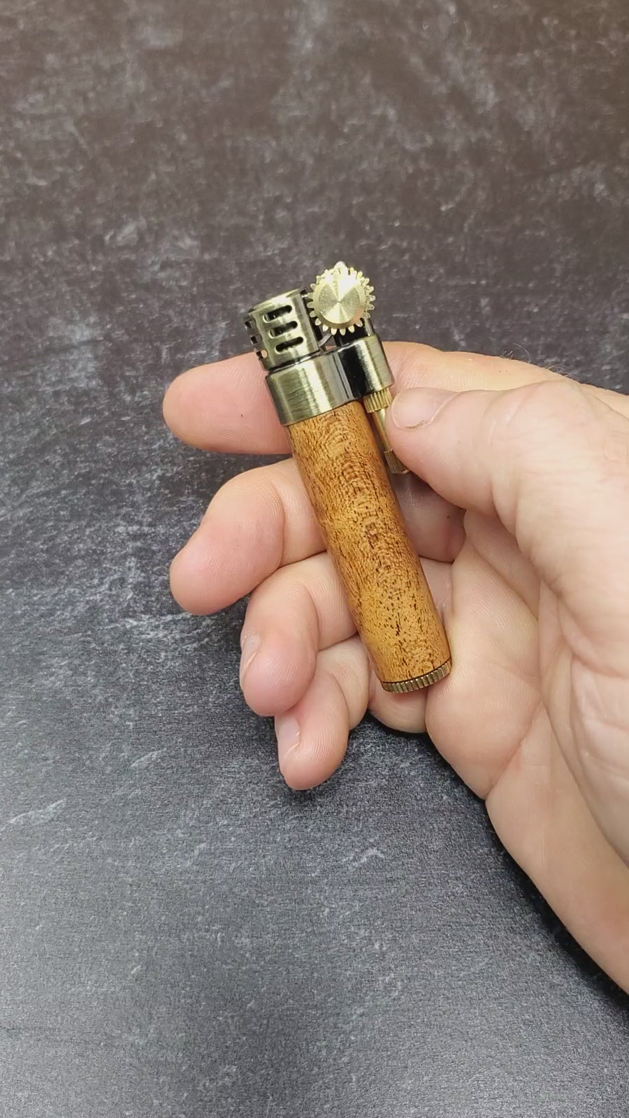 video of a steampunk style slim lighter with a handcrafted wood barrel made from texas mesquite