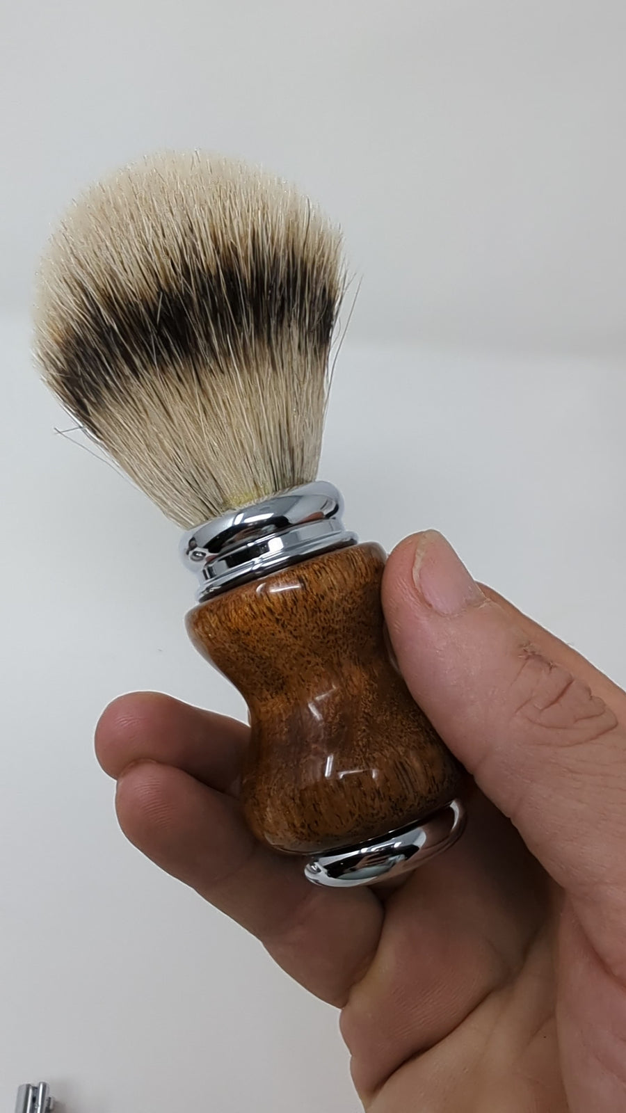 video of a shave brush with a mesquite handle and a silver tip badger knot